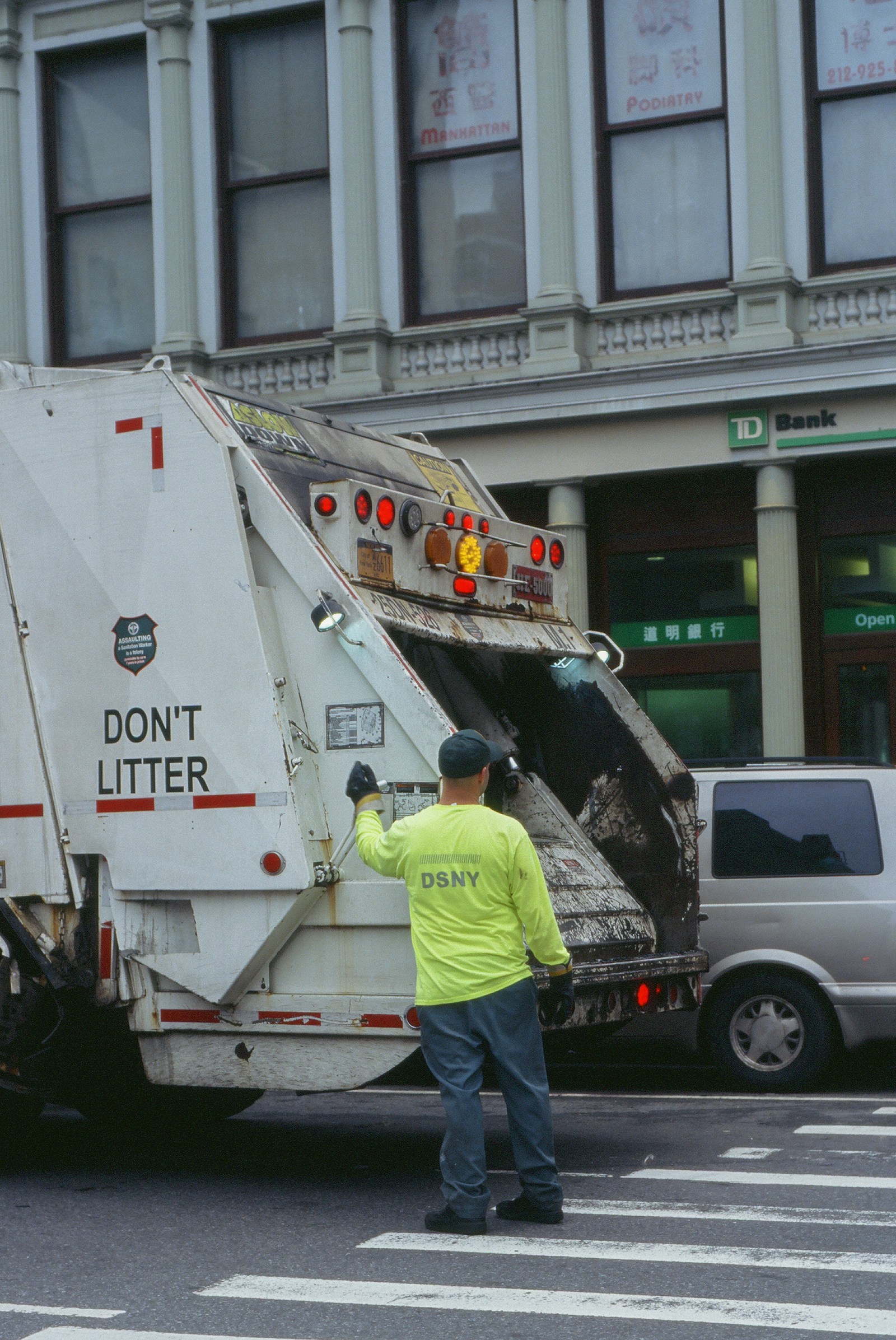 E&J crew loading junk and debris into a hauling truck